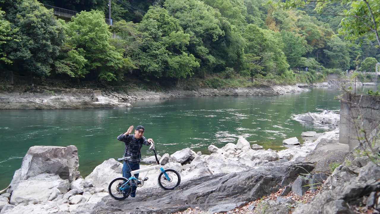 Amakase Dam area - mountain scenery with dam structure visible in distance