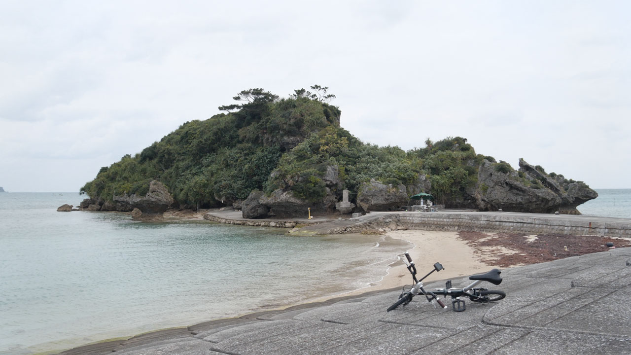 Amamichuu no Haka - small stone monument on grassy area, popular Instagram spot but locals say it's just a regular grave