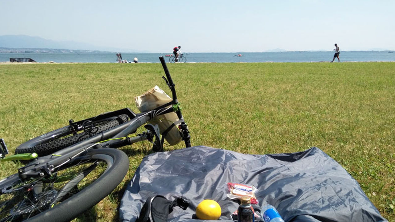 Lake Biwa shoreline view - expansive lake visible from cycling route