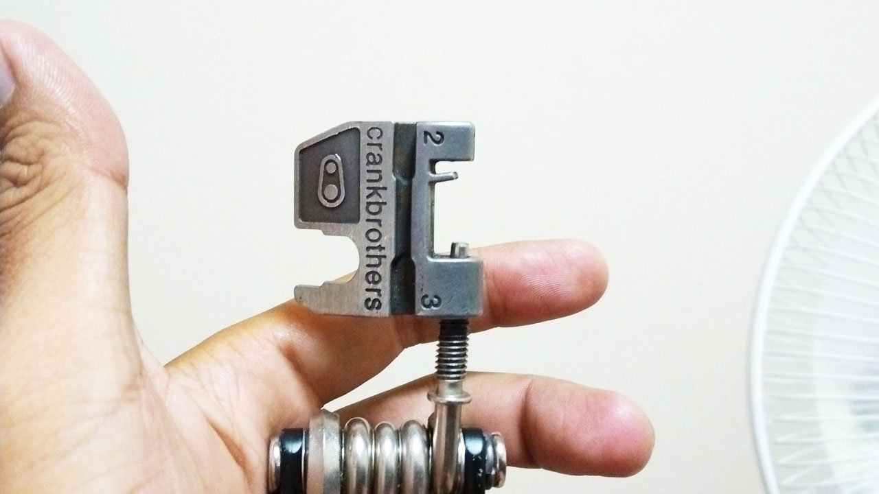 Crank Brothers M17 multi-tool with spoke nipple wrench attachment visible