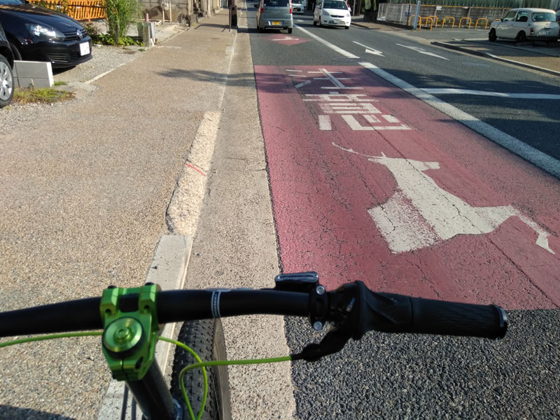 A yellow diamond traffic sign with a picture of a deer