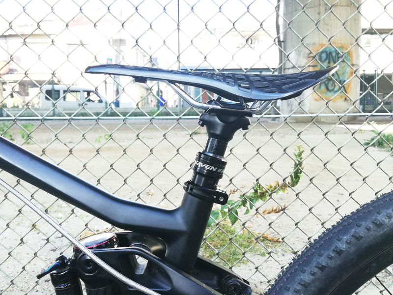 A dropper seatpost shown in its lowered position to lower the rider's center of gravity