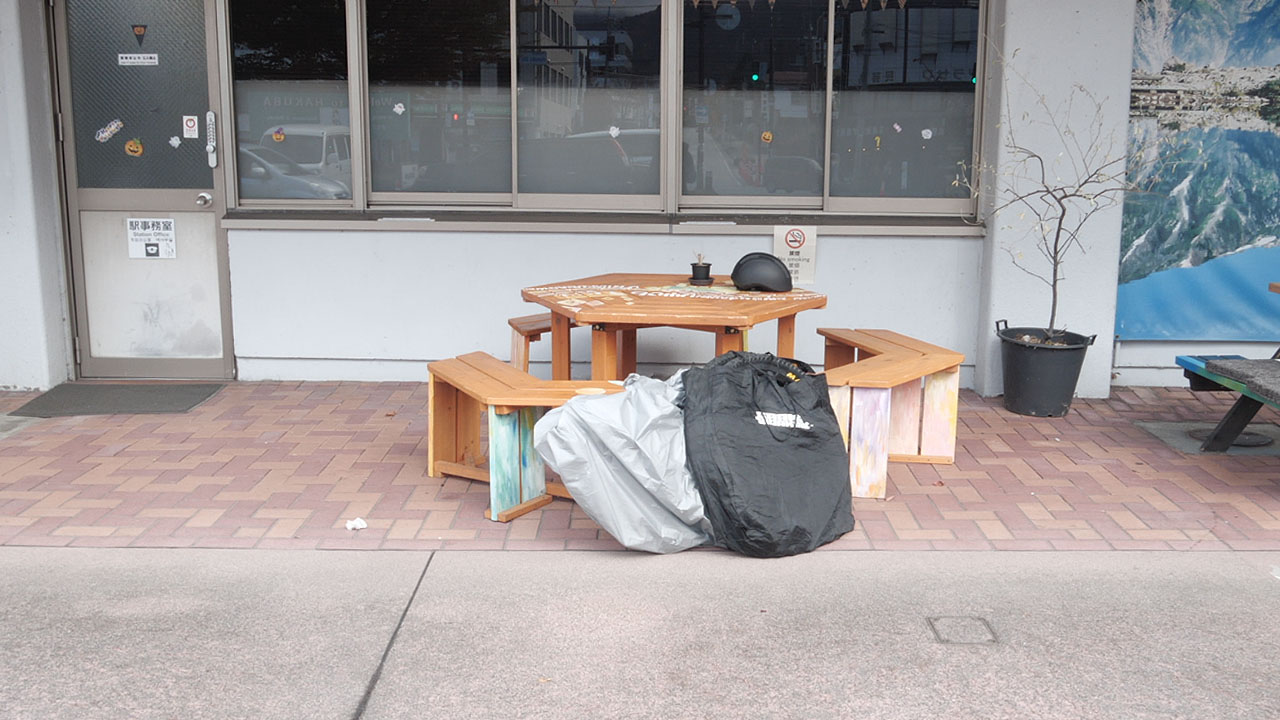 Folding bicycle placed in a carrying bag for train travel in Japan