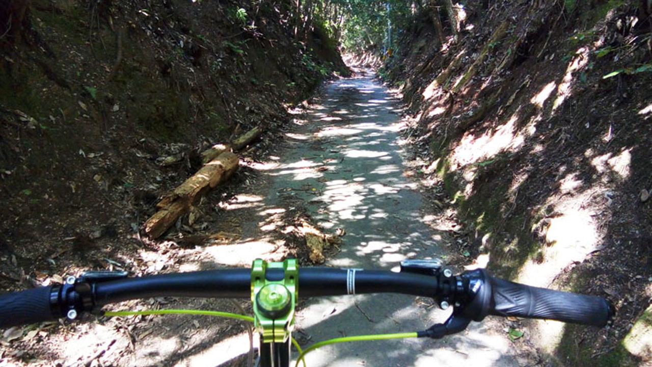 Gravel road surface close-up - textured path showing semi-off-road conditions