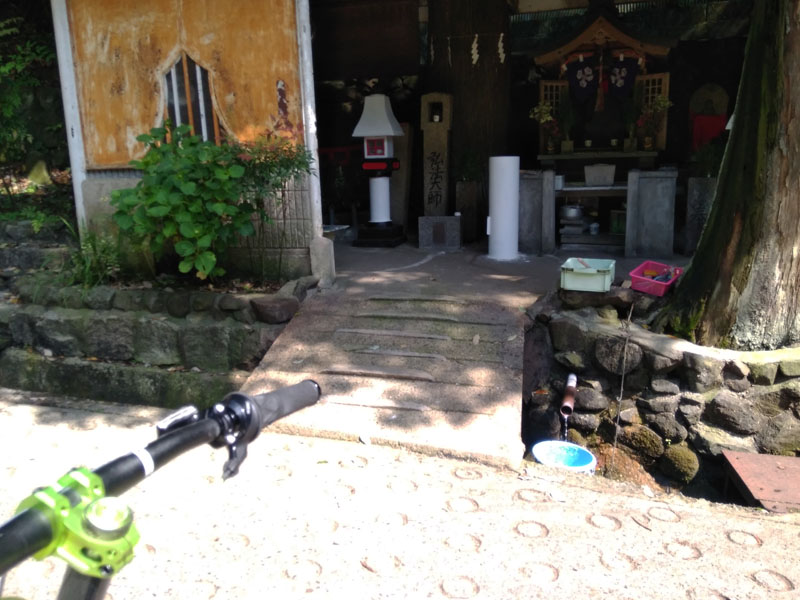 A small stone shrine with fresh water flowing