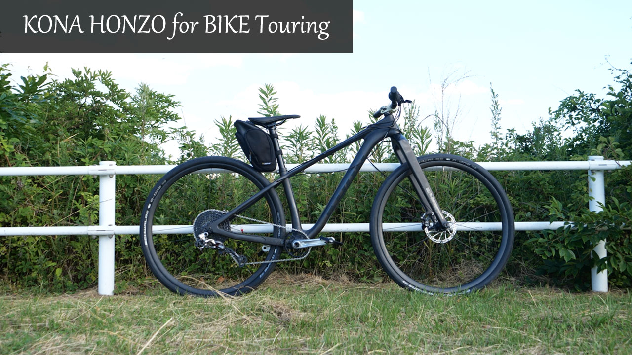 A KONA HONZO lightweight carbon hardtail mountain bike loaded with frame bags