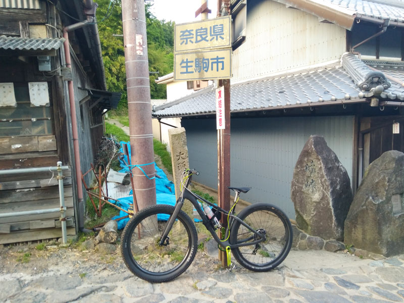 A traditional Japanese tea house situated on a narrow cobblestone road