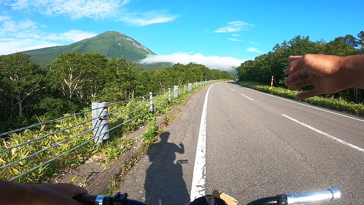 Shiretoko Pass mountain road with Mount Rausu visible - August 7, 2022