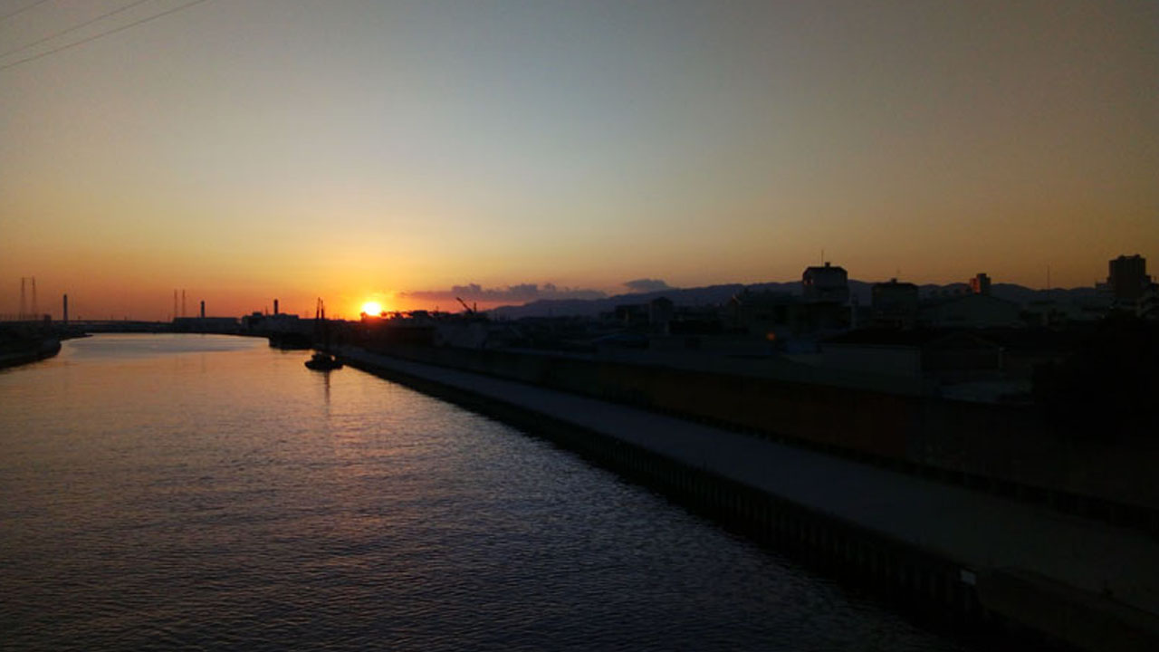 Sunset view over Osaka harbor and city skyline