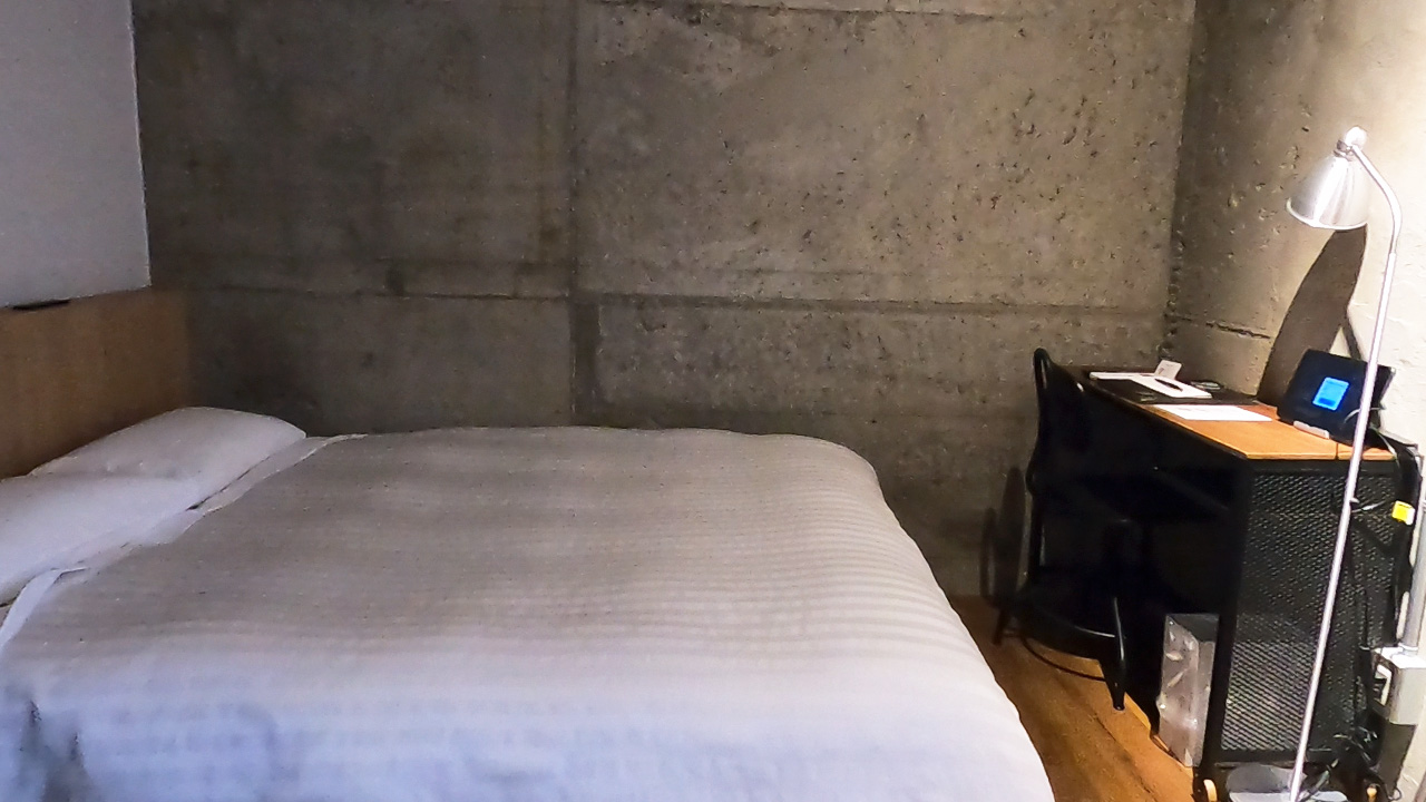 A clean, modern twin room in a Japanese business hotel