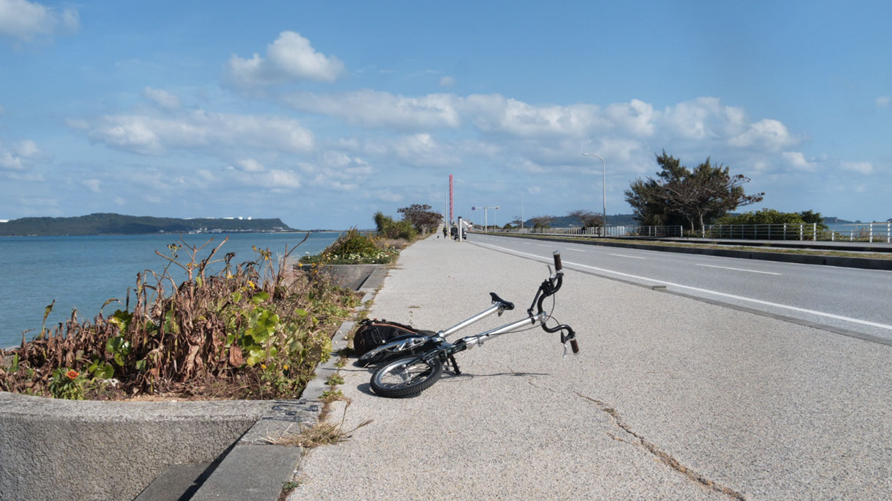 The Kaichu-doro (Sea Road) bridge spanning turquoise waters connecting mainland Okinawa to offshore islands - scenic coastal cycling route